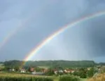 Rainbow over homes