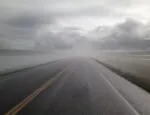 A deserted foggy road