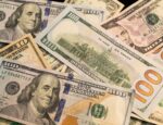 Numerous hundred-dollar, ten-dollar and five-dollar bills.