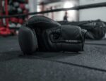 A pair of boxing gloves in a boxing ring.